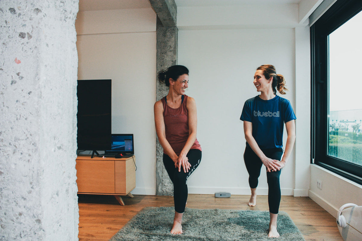 Two women warming up in Blueball tights and tops